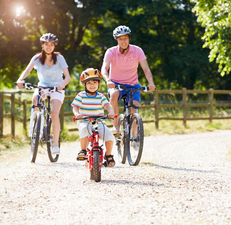 Family biking at a park together