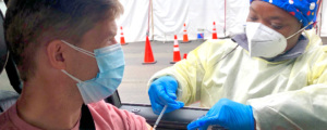 a man in a car receiving a vaccination