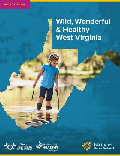 cover page of policy scan featuring a boy walking in the water