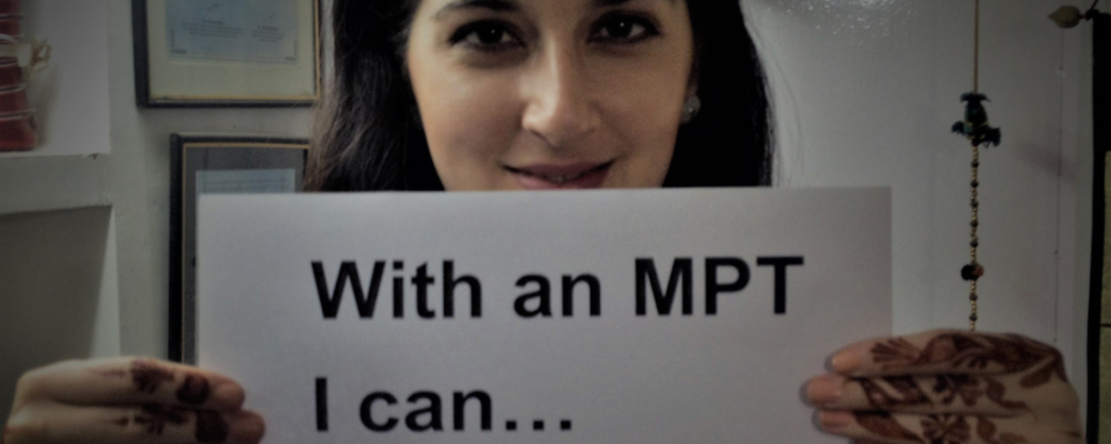 Woman holding a sign that says "With an MPT I can... take charge."