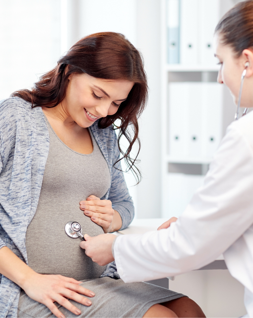 Pregnant person visiting a doctor