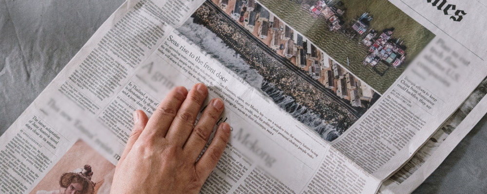 person reading newspaper