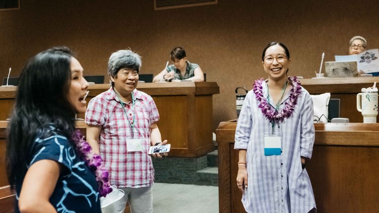 speakers smiling in Hawaii workshop