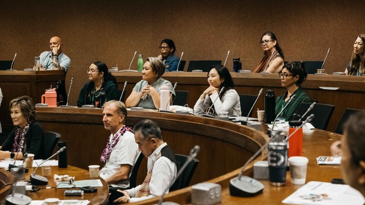 people in workshop seated in a semi circle