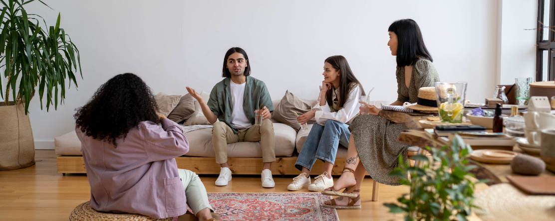 People Sitting on the Living Room Talking