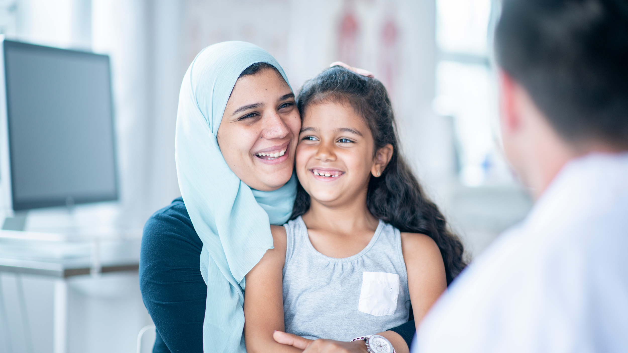 Refugee mother and daughter at doctor's office