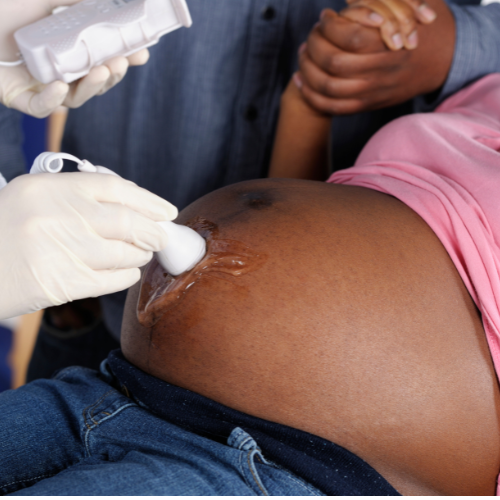 Black pregnant woman at medical appointment