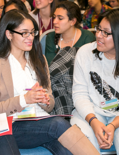 two women speaking to one another during workshop