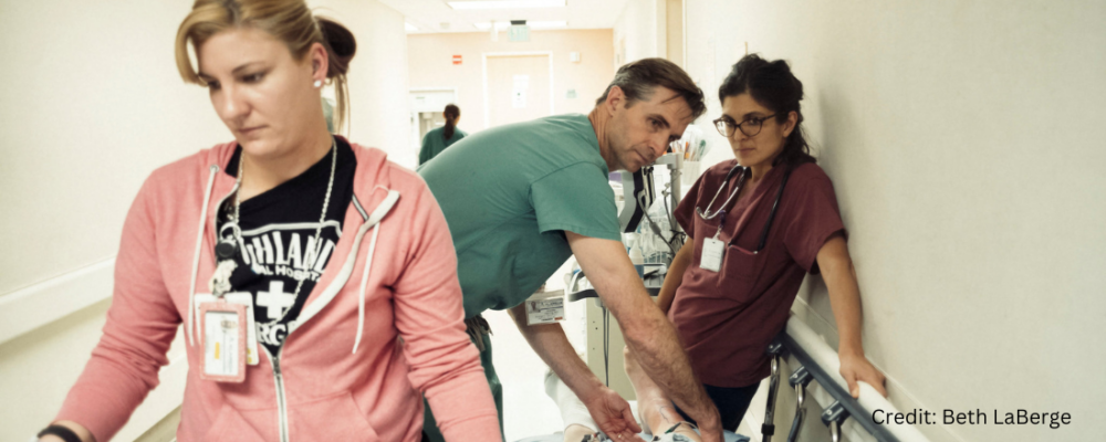 Dr. Andrew Herring and hospital medical staff assisting patient