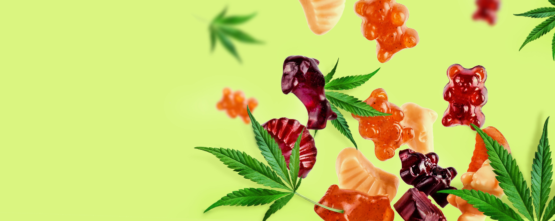 cannabis leaves with colorful gummies